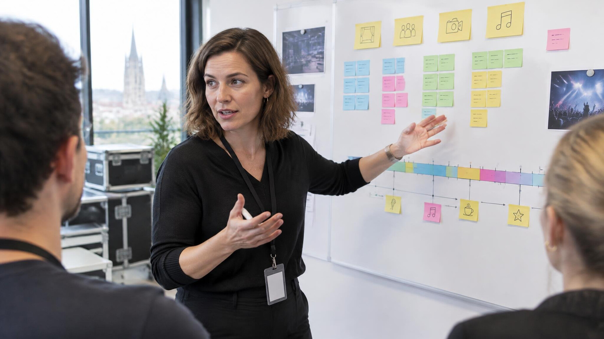 Team planning a show format on a whiteboard with sticky notes
